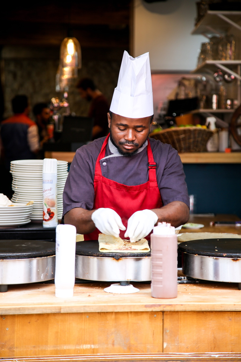 kitchen, occupation, roti, paris, man, restaurant, food, food and drink, person, preparing, one person, waist up, indoors, commercial kitchen, incidental people