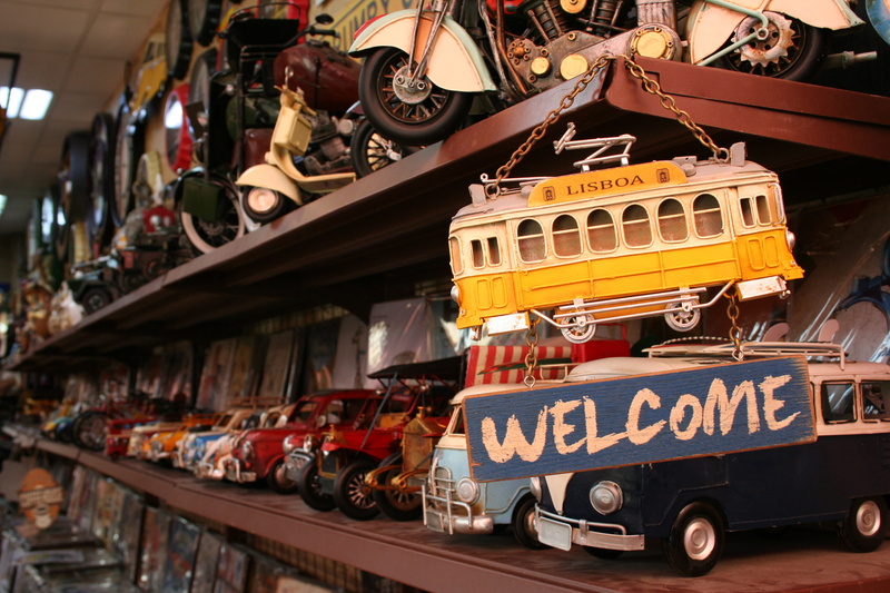 focus on foreground, motor vehicle, public transportation, collection, land vehicle, store, welcoming, antique toys, text, dubai, retail display, no people