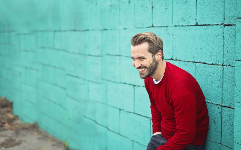 Smiling, wall - building feature, Outdoors, waist up, red, brick, caucasian, turquoise, 2K, Young, outdoor, leaning, men, Adult, smile, winter, one person