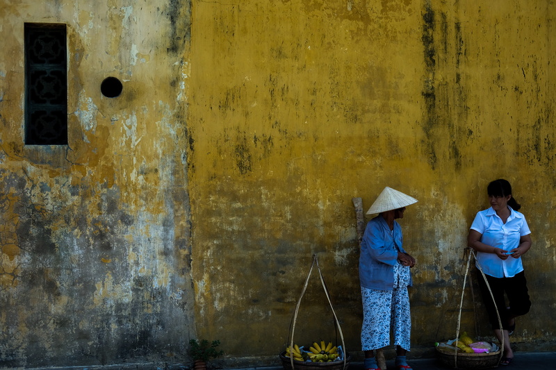 clothing, traditional, seller, rear view, wall - building feature, built structure, smile, person, occupation, street, wall, standing, hat, vietnam, real people