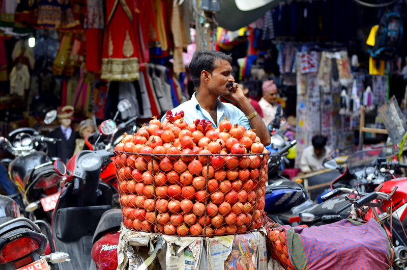 retail, market, abundance, healthy eating, pomegranate, nepal, talking, choice, men, vendor, for sale, traditional, large group of objects, sale, food