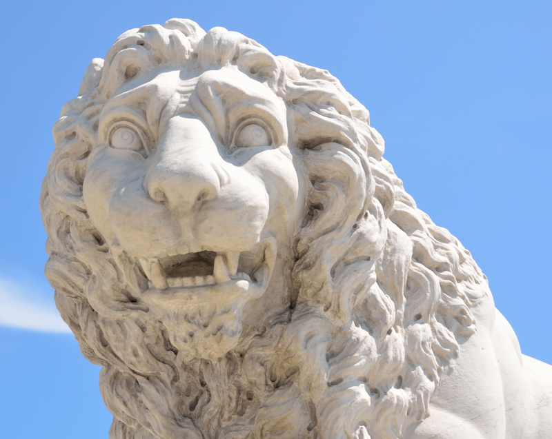 spirituality, male likeness, lion, design, nature, craft, sky, town, human representation, close-up, creativity, representation, monument, symbol, sculpture