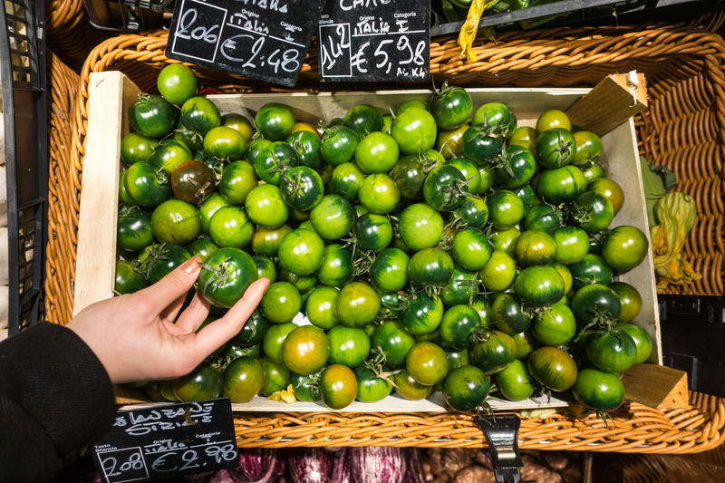 container, adult, human limb, one person, green, store, lifestyles, healthy Eating, hands, Italian, market Stall, basket, tomatoes, finger, selling, green tomatoes