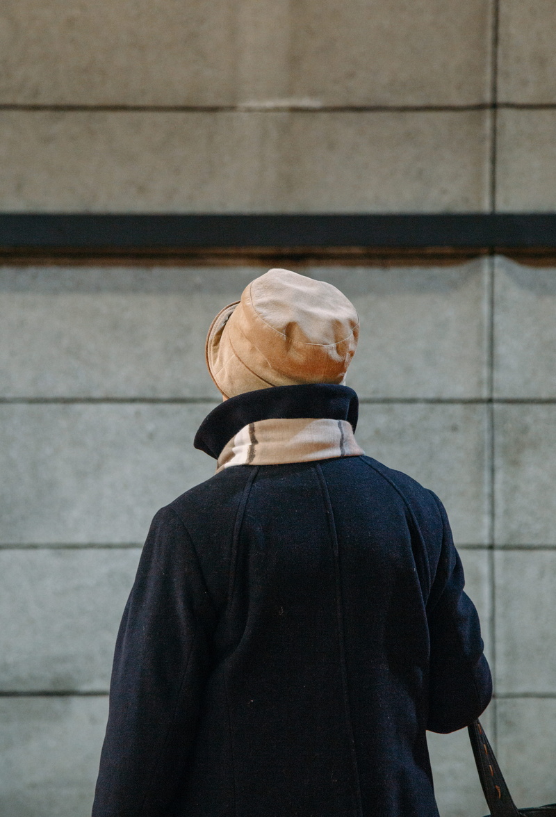 sweatshirt, long sleeve, architecture, wearing, person, human, home decor, lifestyles, wall - building feature, apparel, focus on foreground, day, sun hat