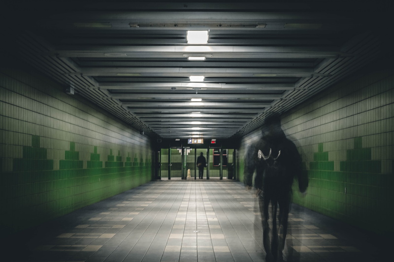 light, architecture, direction, jacket, indoors, hooded, underpass, the way forward, men, walking, train, public transportation, lights, transportation