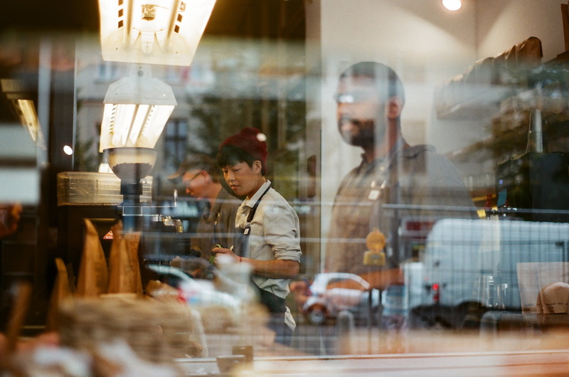 window shopping, vehicle, window, coffee shop, occupation, car, restaurant, cafe, inside, transparent, business, store, city, apparel, young adult, food