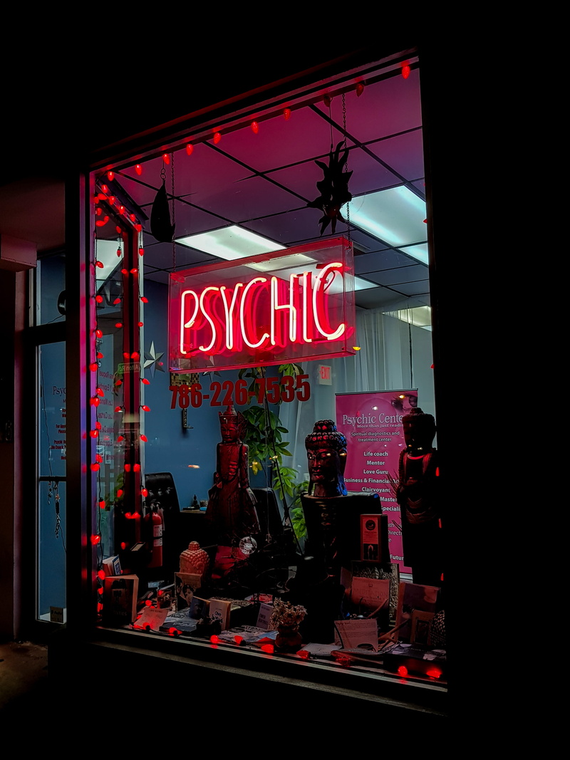 alphabet, retail, text, cafe, food and drink, western script, psychic, shoe shop, machine, night, red, spoke, illuminated, commercial sign, city, neon