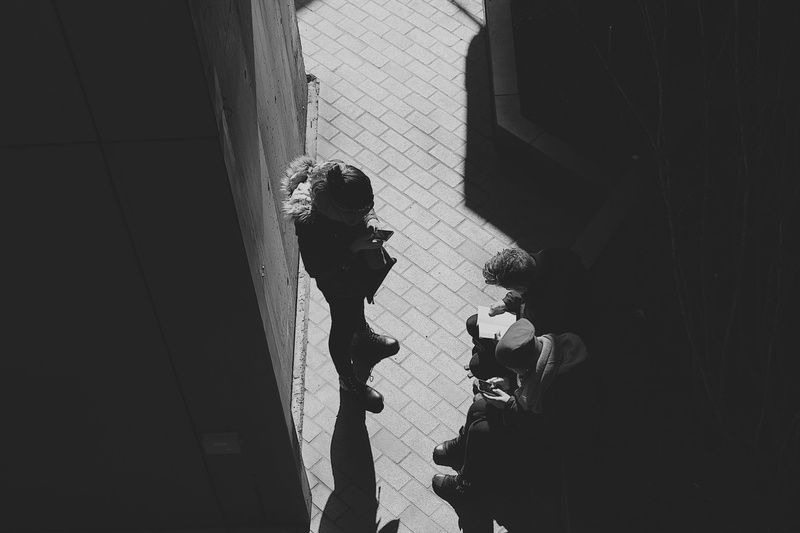 coat, people, apparel, overcoat, handrail, advertisement, human, shadow, photo, shoe, standing, occupation, clothing, photographer, photography, architecture
