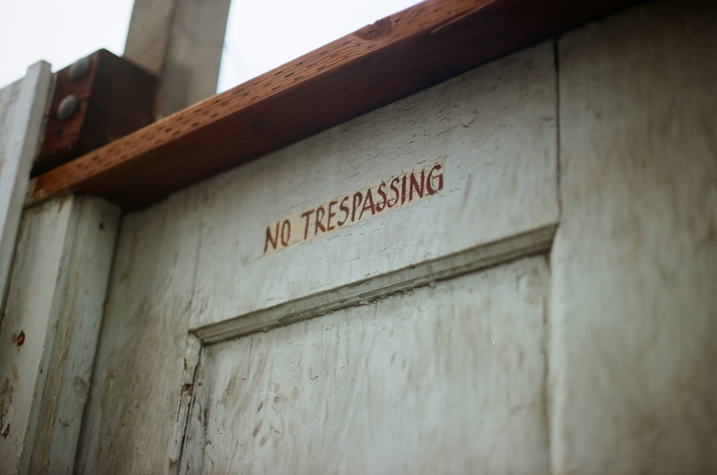 window, day, coat, information, low angle view, building, selective focus, clothing, direction, nature, bunker, sign, no people, home decor, postal office
