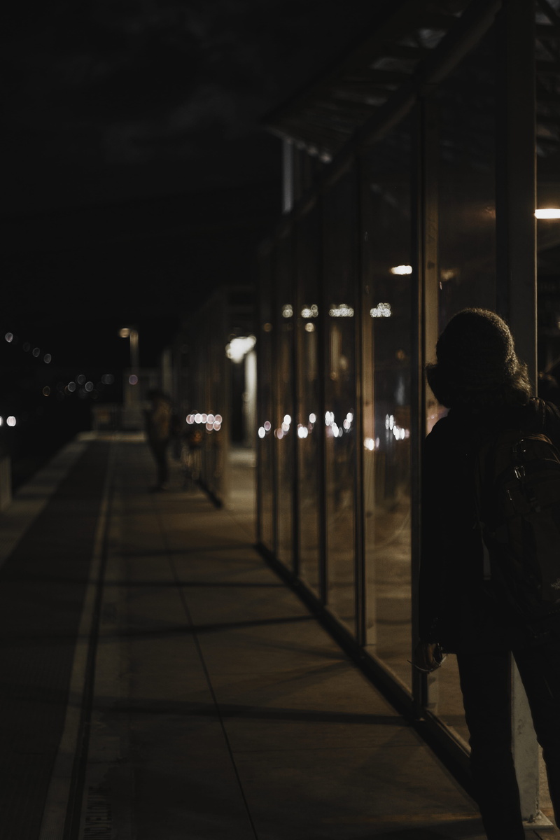warm clothing, architecture, apparel, person, street, train, metro, banister, night, one person, real people, pavement, lifestyles, pedestrian, low light