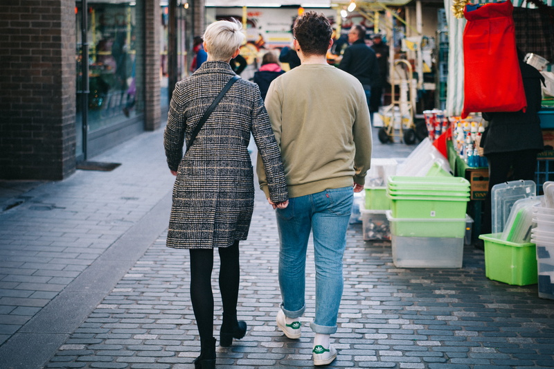 two people, lifestyles, city, women, consumerism, cobblestone street, goods, architecture, shop, group, shopping, merchandise, footpath, tourist, stores