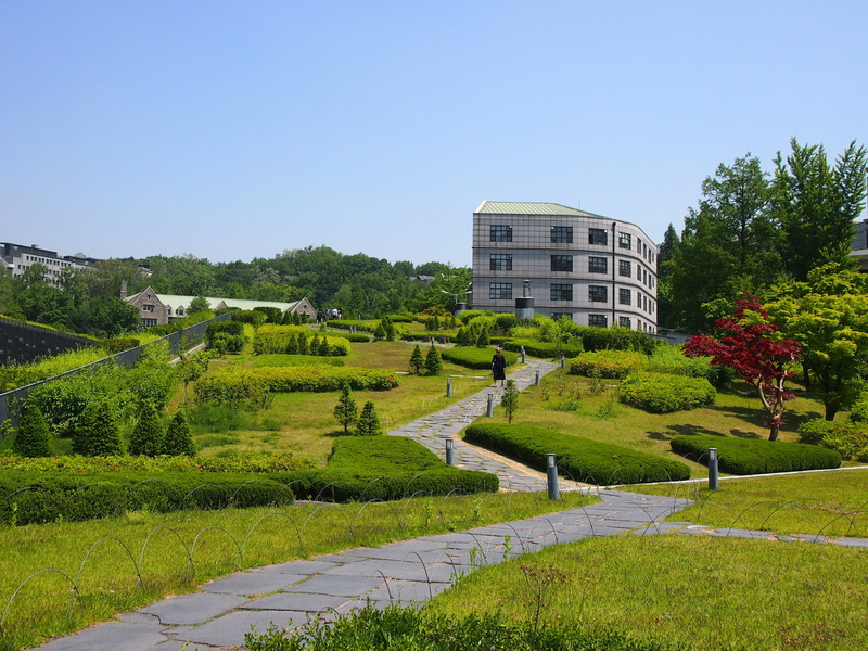garden, building exterior, park, built structure, land, building, day, grass, clear sky, outdoors, landscape, hedge, tree, ewha, beauty in nature, plant