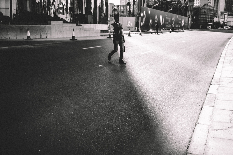 one person, street, full length, direction, city street, urban, walking, city life, footpath, art, transportation, men, rear view, street photography, building exterior