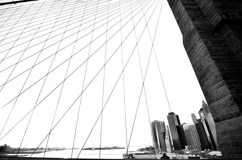 transportation, low angle view, building exterior, travel destinations, engineering, cable-stayed bridge, outdoors, travel, built structure, financial district