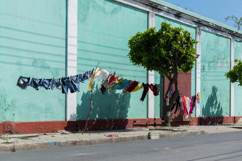 abandoned, clothesline, color, laundry, no people, plant, clothing, graffiti, clothes line, built structure, assorted, clothes, domestic, nature, washing line