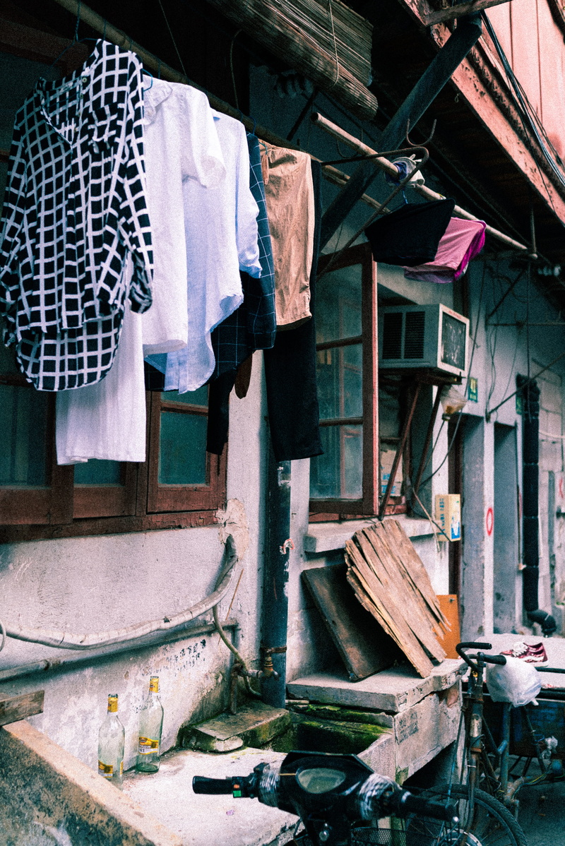 drying, textile, outdoors, house, outside, window, clothing, wood - material, hanging, home, building, residential district, abandoned, transportation
