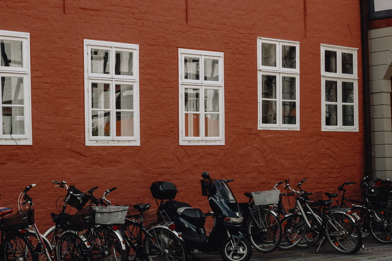 residential district, transportation, mode of transportation, building, walkway, vespa, day, parking, bicycle, city, wall - building feature, outdoors