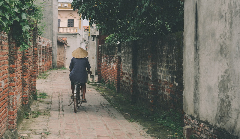 concrete wall, countryside, building exterior, transportation, lifestyles, street, Mossy, vietnam, landscape, full length, land vehicle, mode of transportation