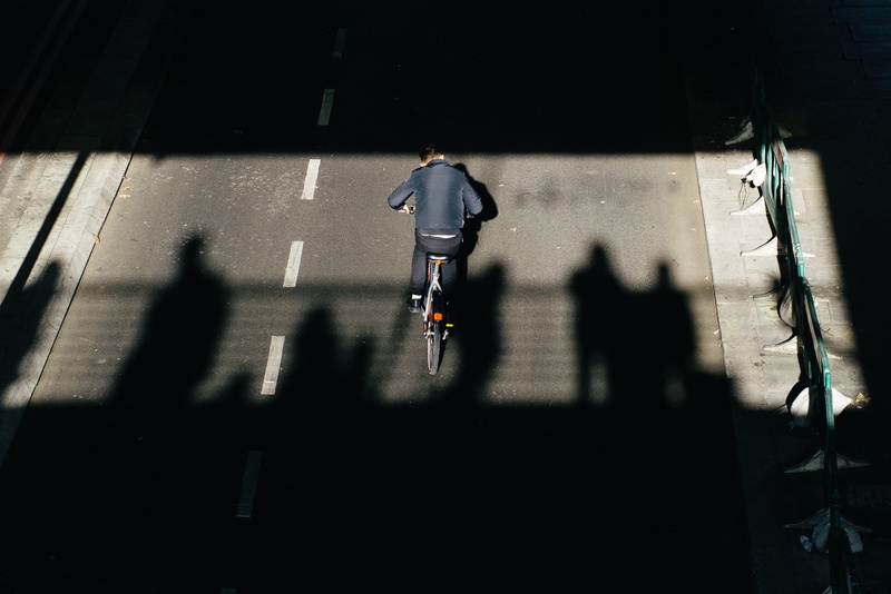 outdoor, architecture, 2K, bicycle, rear view, urban Scene, real people, silhouette, outdoors, guy, street, bike, adult, riding, shadow, blurred Motion