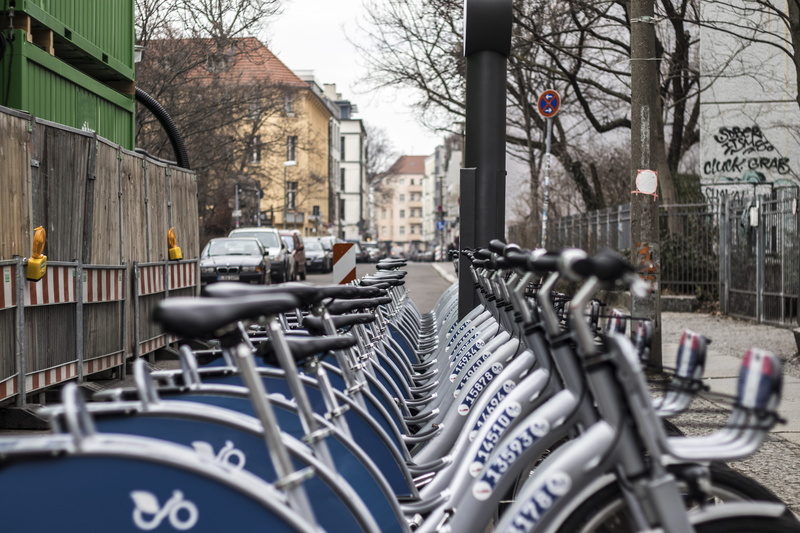 architecture, nature, parking, building exterior, person, parked, lot, bmx, built structure, vehicle, car, town, human, machine, parking lot, building