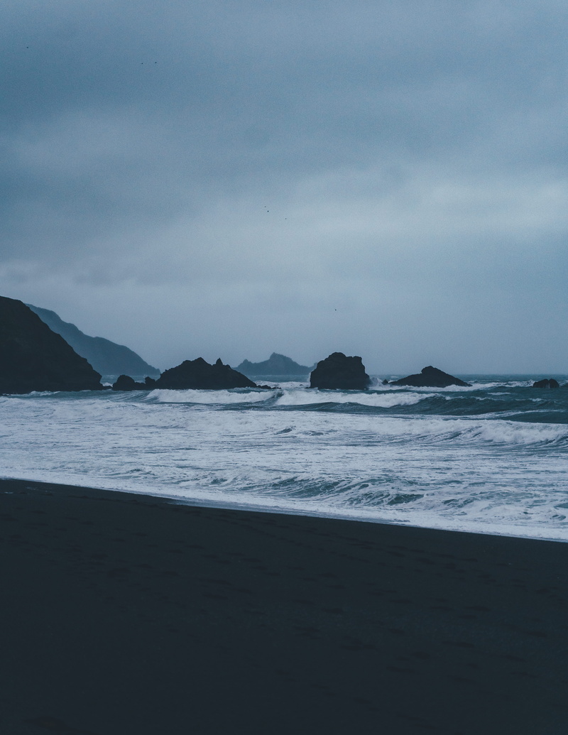 tranquil scene, storm, blue, black sand, waves, sky, nighttime, black sand beach, moody, beauty in nature, sea waves, united states, no people, pacifica