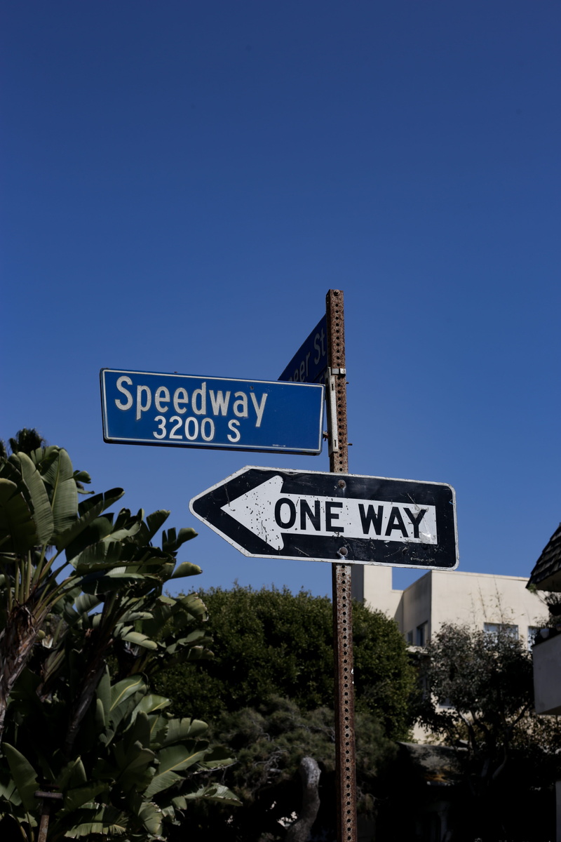 street, stopsign, tree, nature, united states, text, street signs, signs, emblem, urban, low angle view, buildings, road sign, clear sky, one way, direction