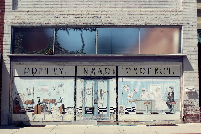 wall, concrete, glass - material, creativity, male likeness, facade, painted, building, text, cafe, no people, structure, built structure, pathway, brick