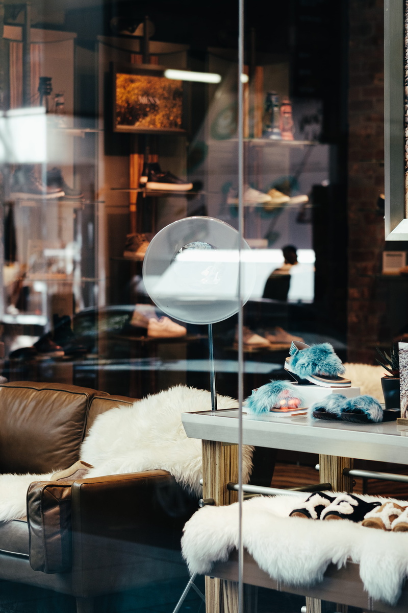 street photography, window, textile, sofa, storefront, shop, illuminated, glass, fashion, store, lighting equipment, beside, retail display, black, rack