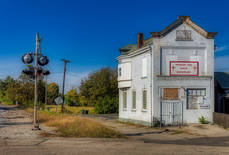 neighborhood, sign, no people, abandoned, city, building exterior, western script, mood, christianity, outdoors, transportation, clear sky, buildings, america