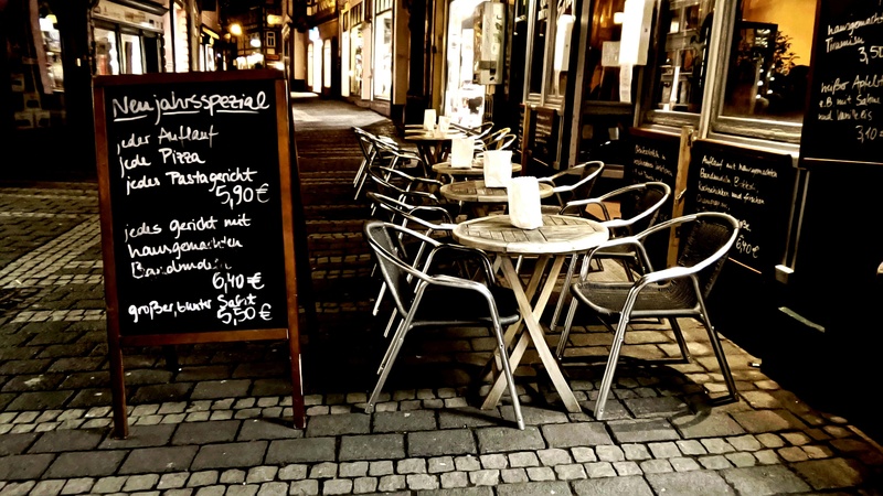 food and drink, beer, menu, night, communication, street, bar - drink establishment, text, wine glasses, drink, seat, cafe, eat, paving stone, sidewalk