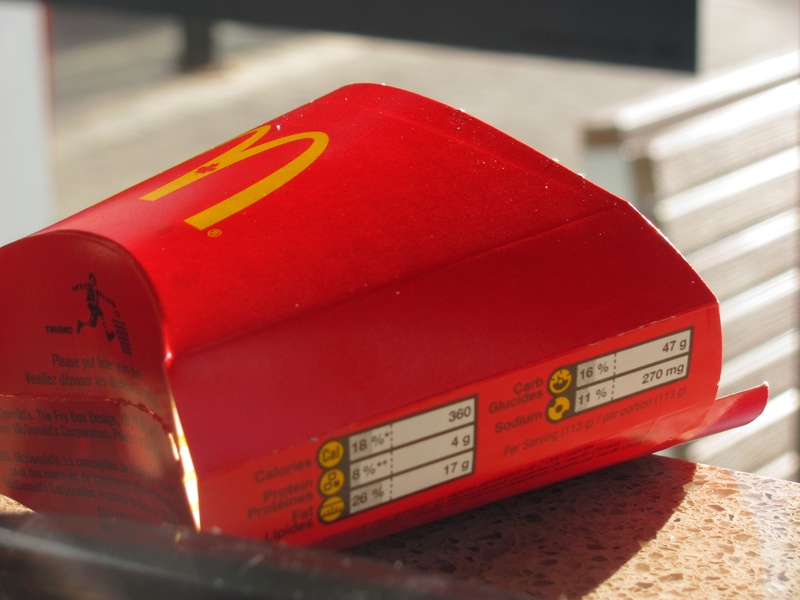 fries, connection, no people, mcdonalds, single object, empty, close-up, red, day, focus on foreground, western script, table, french, container, technology