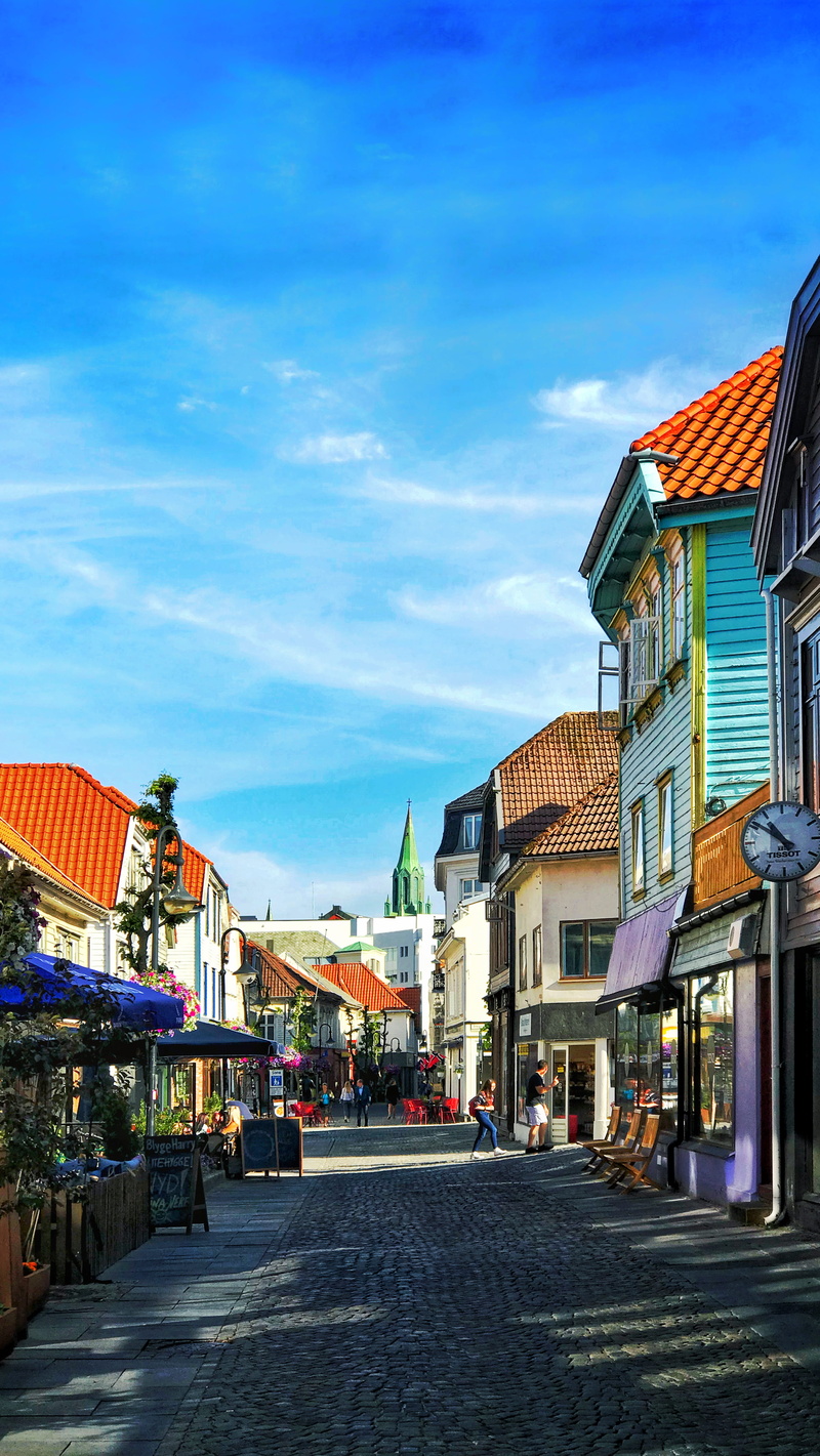 sidewalk, incidental people, sky, spire, concrete, stavanger, tower, street market, neighborhood, nature, direction, architecture, nedre holmegate 30, house
