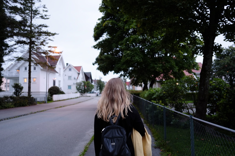 tree, sidewalk, girl, standing, hair, one person, architecture, norway, springtime, outdoors, road, building, adult, beside, pavement, street, walking