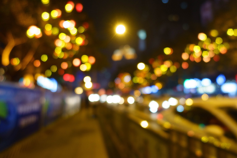 motion, light, light - natural phenomenon, street light, streets, city, out of focus, mode of transportation, bright, outdoors, traffic, lighting equipment