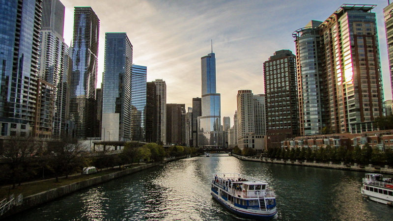 city, architecture, cityscape, 2K, outdoors, water, sky, yacht, passenger craft, transportation, building exterior, financial district, office building exterior