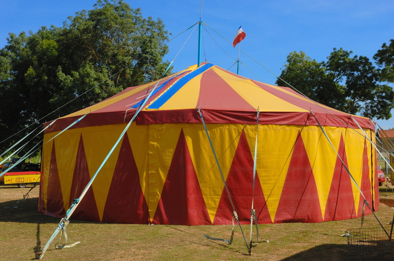 multi colored, clear sky, entertainment tent, red, architecture, sky, outdoors, Circus Tent, Marquee, land, stage, nature, yellow, plant, built structure