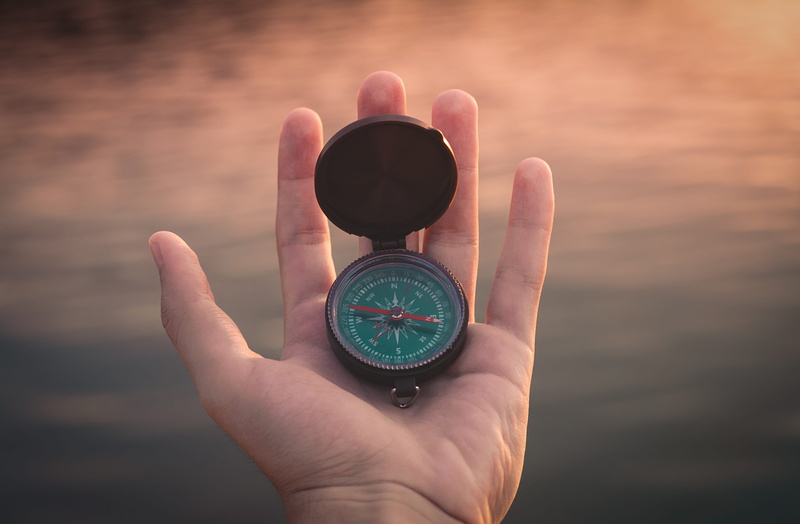 close-up, lost, technology, person, green, one person, human hand, guidance, time, lake, black, finger, hand, body part, closeup, west, holding, travel