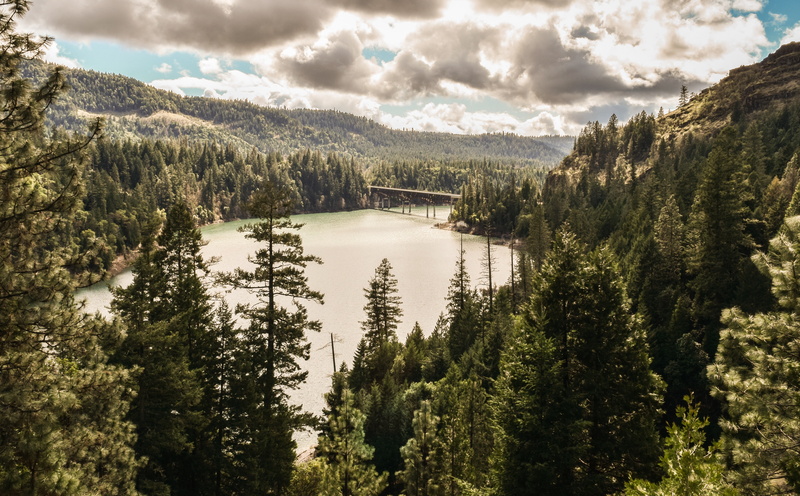 sky, blue, pine tree, non-urban scene, creek, tree, growth, scenics - nature, tranquility, woodland, cloud - sky, mountain, green, lake, trees, plant, water