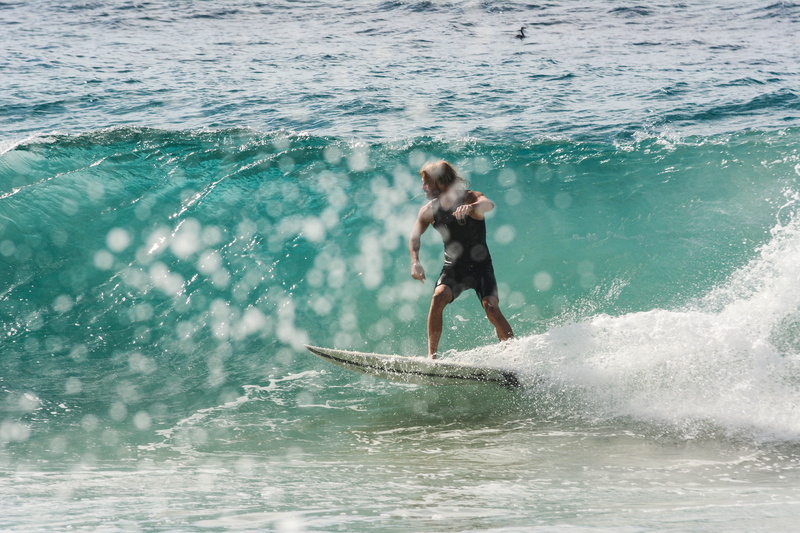 person, splash, surf, outdoors, waves, wet, daytime, surfer, holiday, aquatic sport, water sports, surfboard, motion, wave, body, leisure activity, waterfront