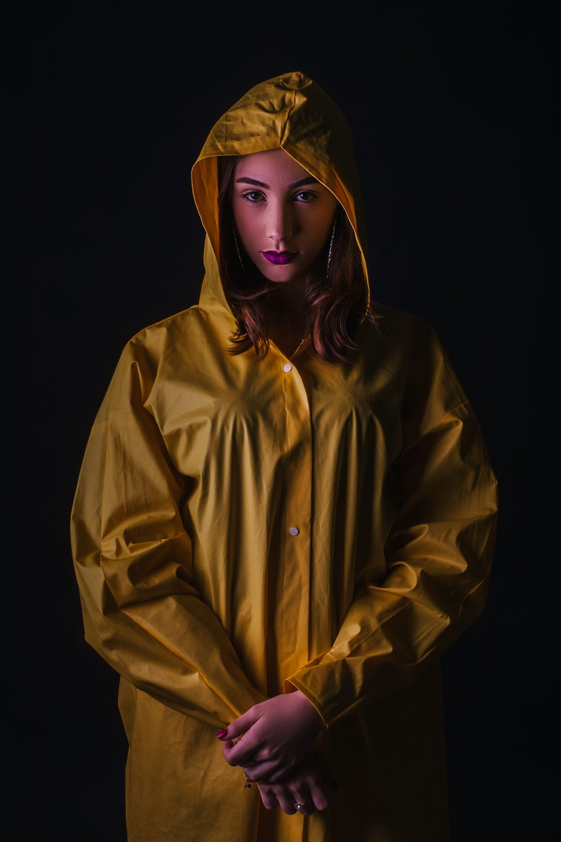 model, black background, fashion, standing, pretty, dark, studio, adult, jacket, indoors, beautiful woman, wearing, front view, photoshoot, 2K, yellow