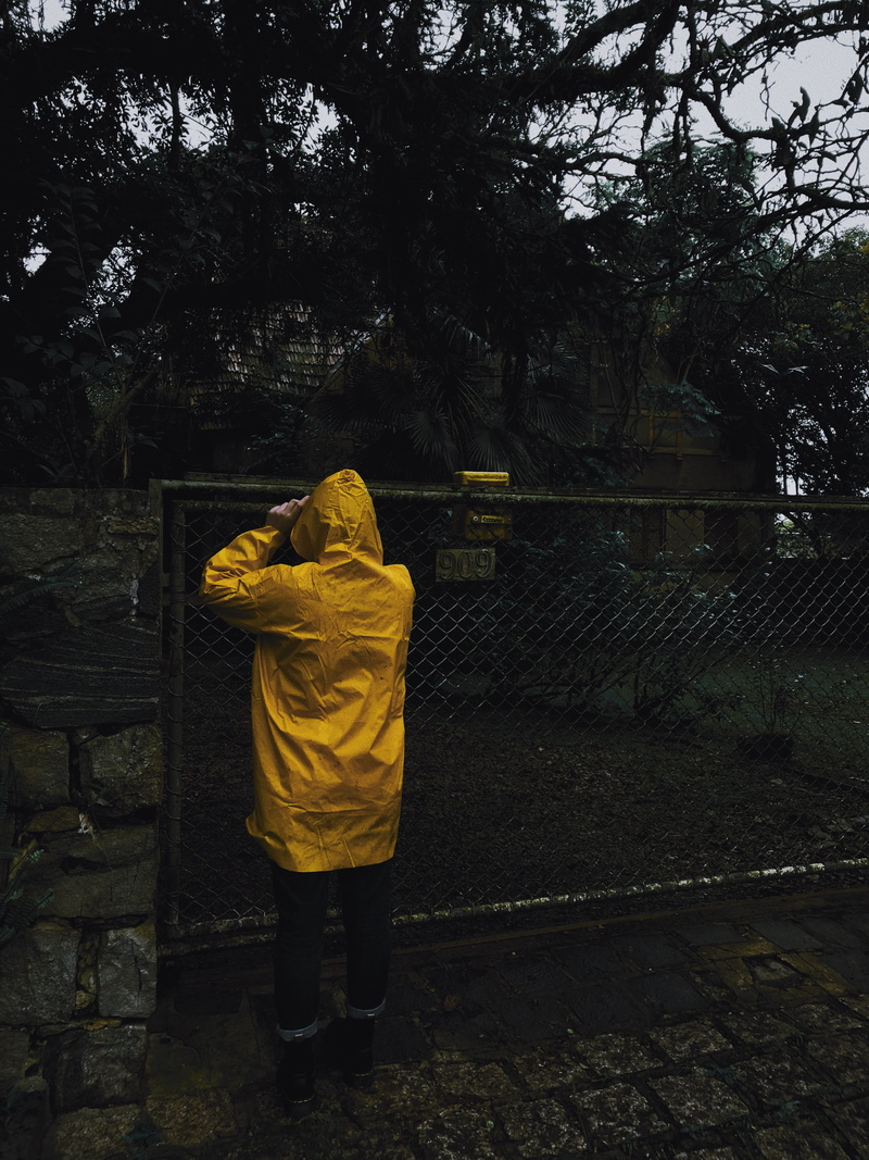 full length, wear, rain, day, nature, rear view, architecture, lifestyles, religion, outdoors, man, gate, standing, raincoat, casual clothing, built structure
