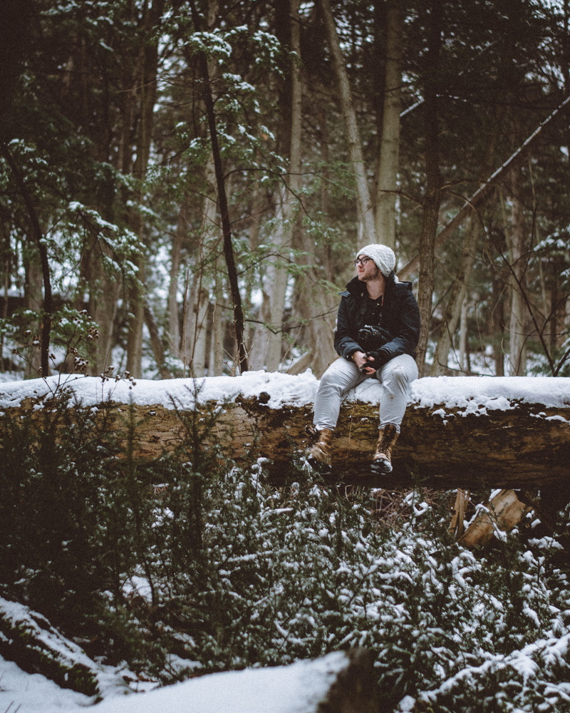 nature, real people, fun, winter, mature men, cold temperature, daytime, land, cap, front view, season, 4K, sit, tree trunk, lifestyles, trunk, jacket