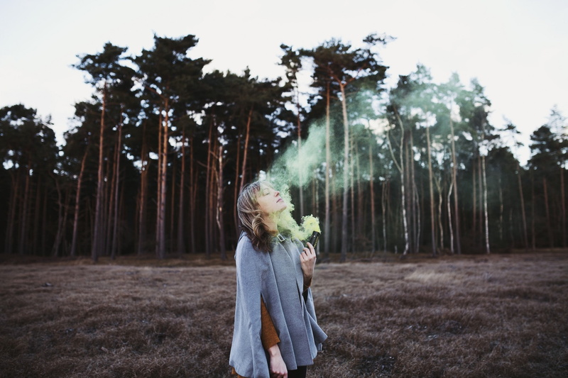 women outdoors, 1080P, colored smoke, hairstyle, day, field, woodland, one person, outdoors, land, ponchos, real people, leisure activity, women, closed eyes