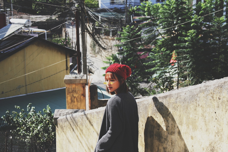 real people, contemplation, headband, alone, casual clothing, maroon, built structure, poncho, 5K, building exterior, tree, day, slate, woman, young men