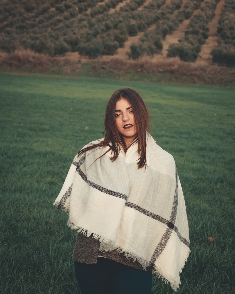day, young women, front view, beautiful woman, standing, grass, person, leisure activity, warm clothing, clothing, poncho, plant, women, apparel, nature