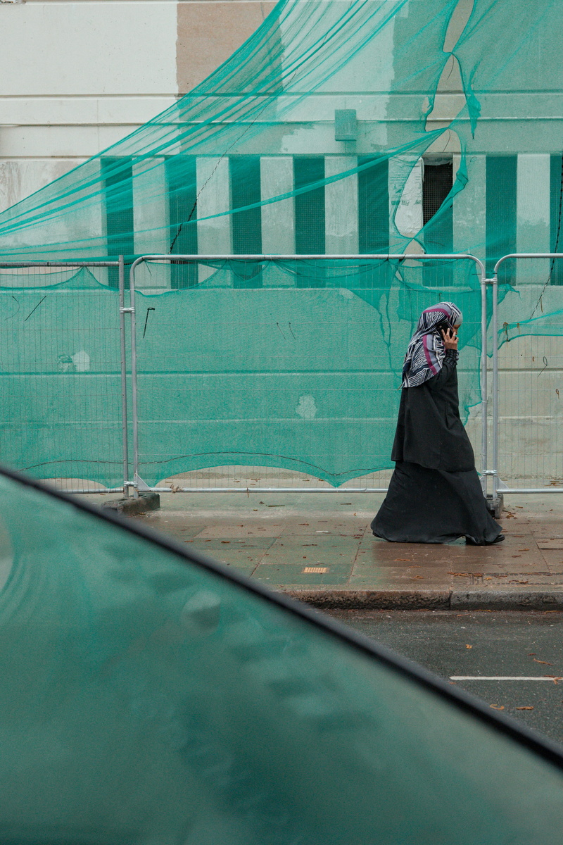 handrail, overcoat, cape, banister, green color, walking, pedestrian, fence, chain, young women, wall, 4K, transportation, real people, human, building