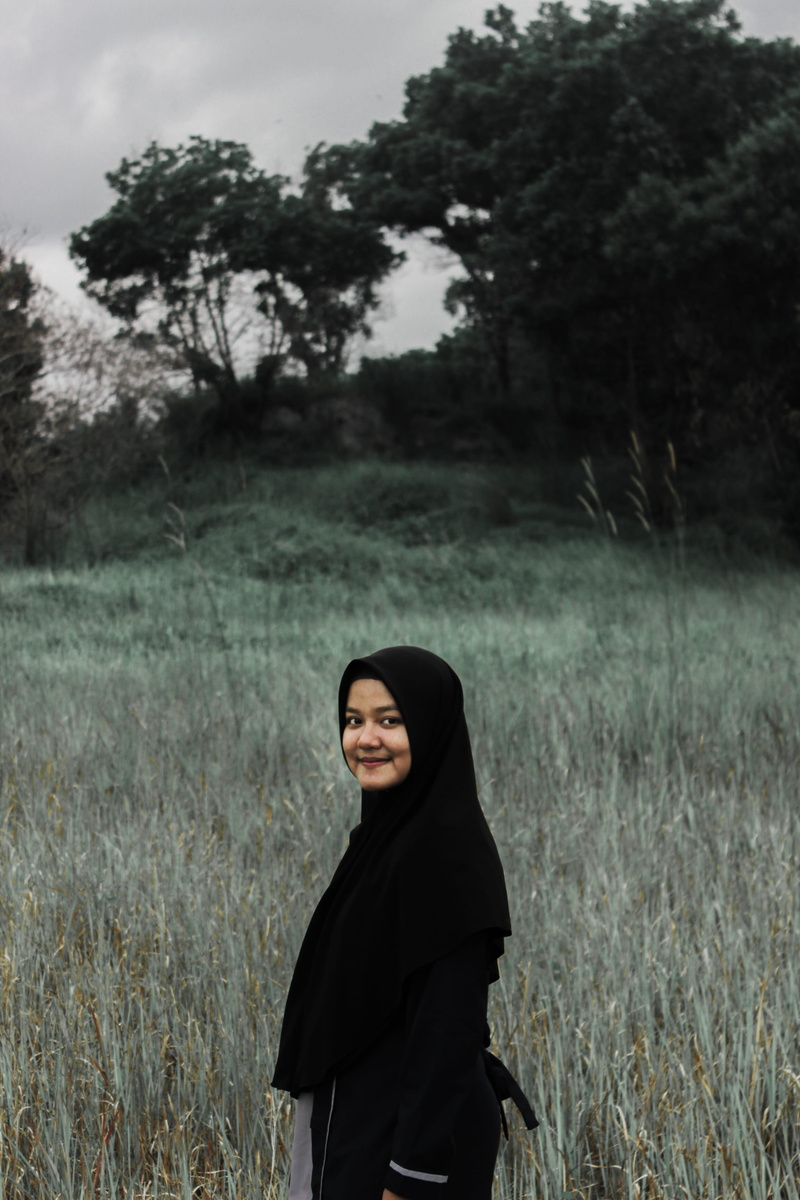 portrait, face, tree, apparel, young adult, evening dress, grass, person, hood, cloak, human, land, poncho, sweatshirt, adult, coat, sleeve, ground, real people