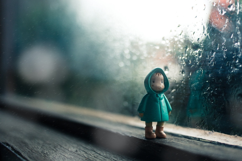 window, full length, cold - Temperature, outdoors, indoors, coat, figurine, boys, day, weather, girls, wearing, street, raindrop, fun, looking, one Person