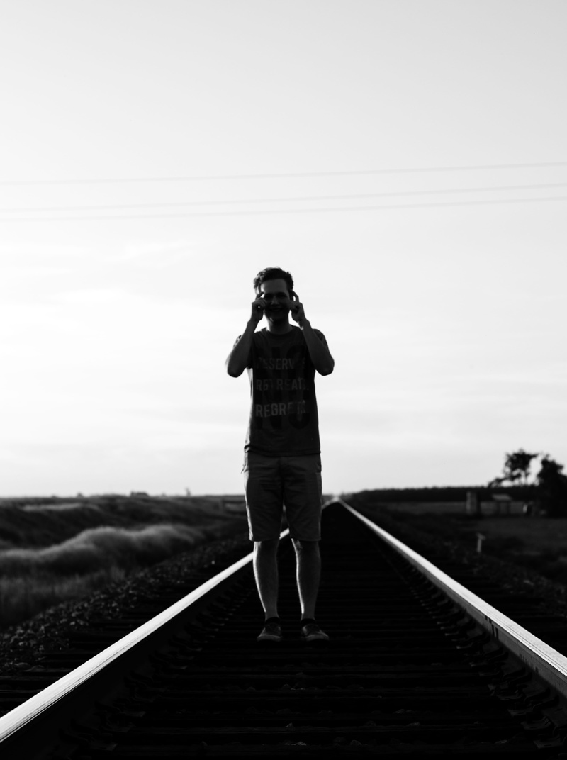 picture, nature, laugh, real people, full length, laton, casual clothing, railroad track, rear view, technology, leisure activity, one person, photography themes