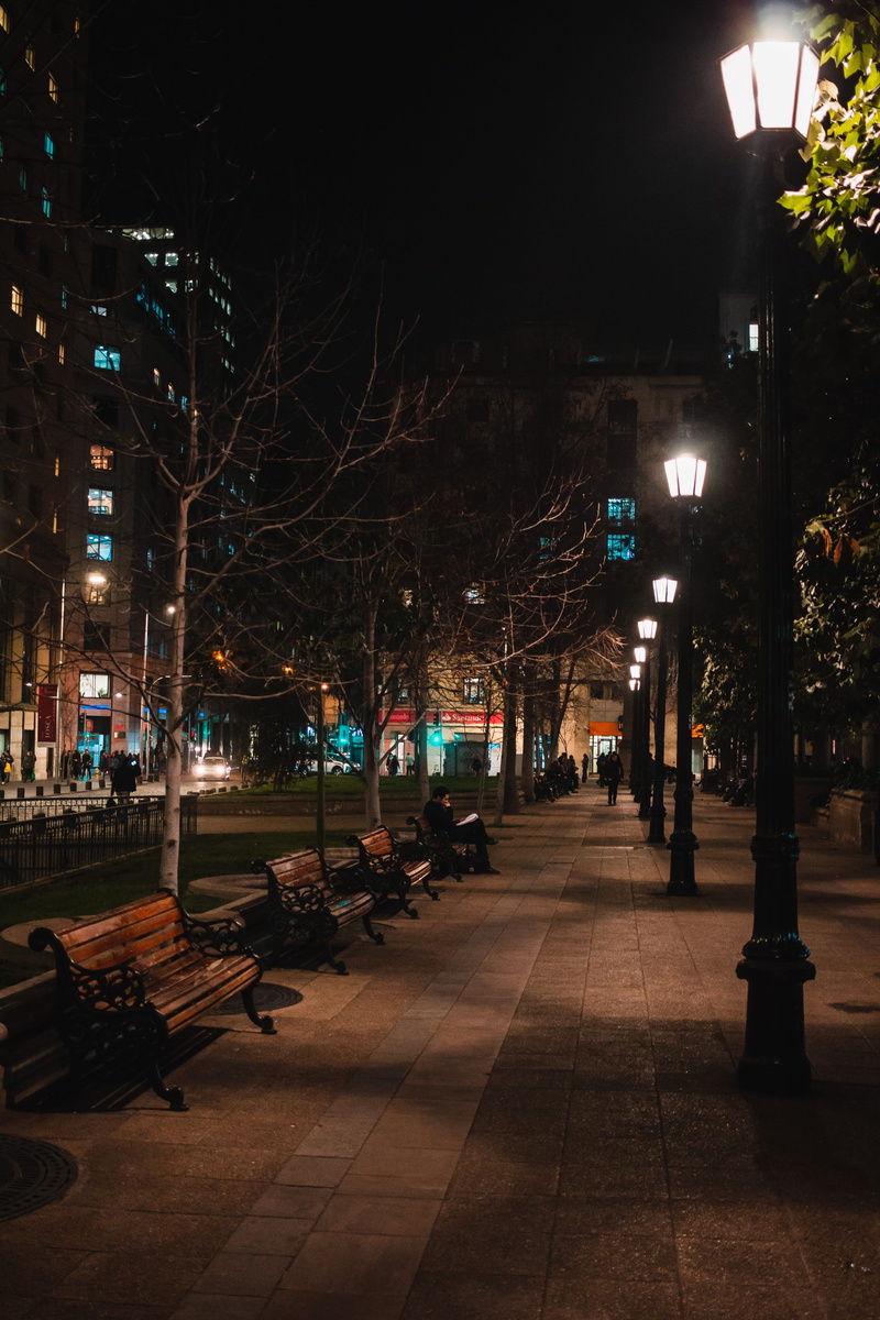 illuminated, lighting equipment, pavement, lighted, town, walking, built structure, lights, architecture, street light, buildings, trees, sidewalk, street lamps